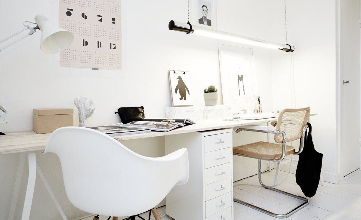 Cool-toned atmospheric layer matching the site visual theme, suggesting Nordic daylight over an editorial workspace